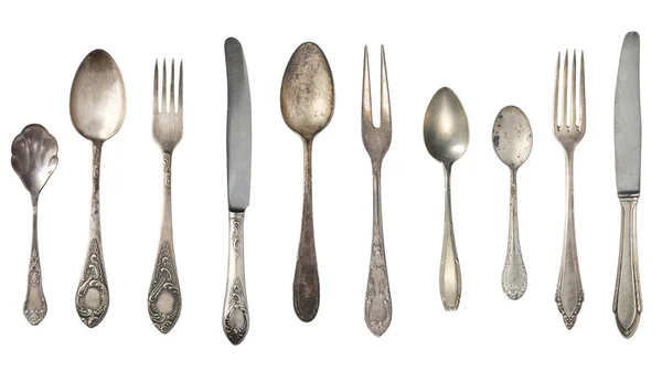 Top view of beautiful vintage silver knifes, spoons and forks i — Stock Image Top view of beautiful vintage silver knifes, spoons and forks i Royalty Free Stock Images