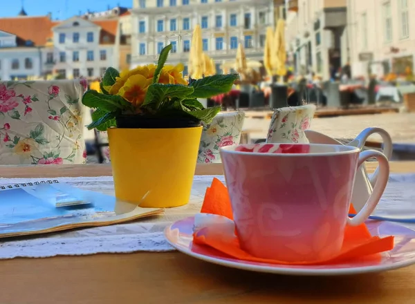 Street Cafe tables and chair   in the city waiting People  for relax  and have cup of coffee travel to Europa Baltic Old Town Of Tallinn Estonia Sunny Afternoon on Town Square travelling to Europa