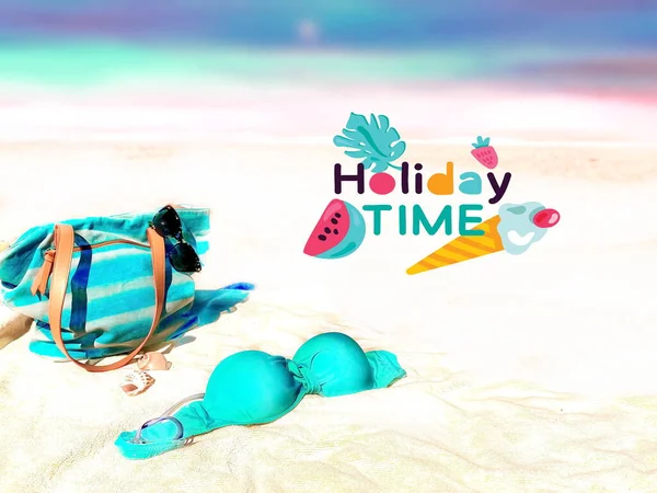 summer  holiday time text banner beach sand women  bikini  and blue bag   with blue bow and handbag bikini beachwear clothes relaxing sunshine leisure clothes on horizon blue sky background