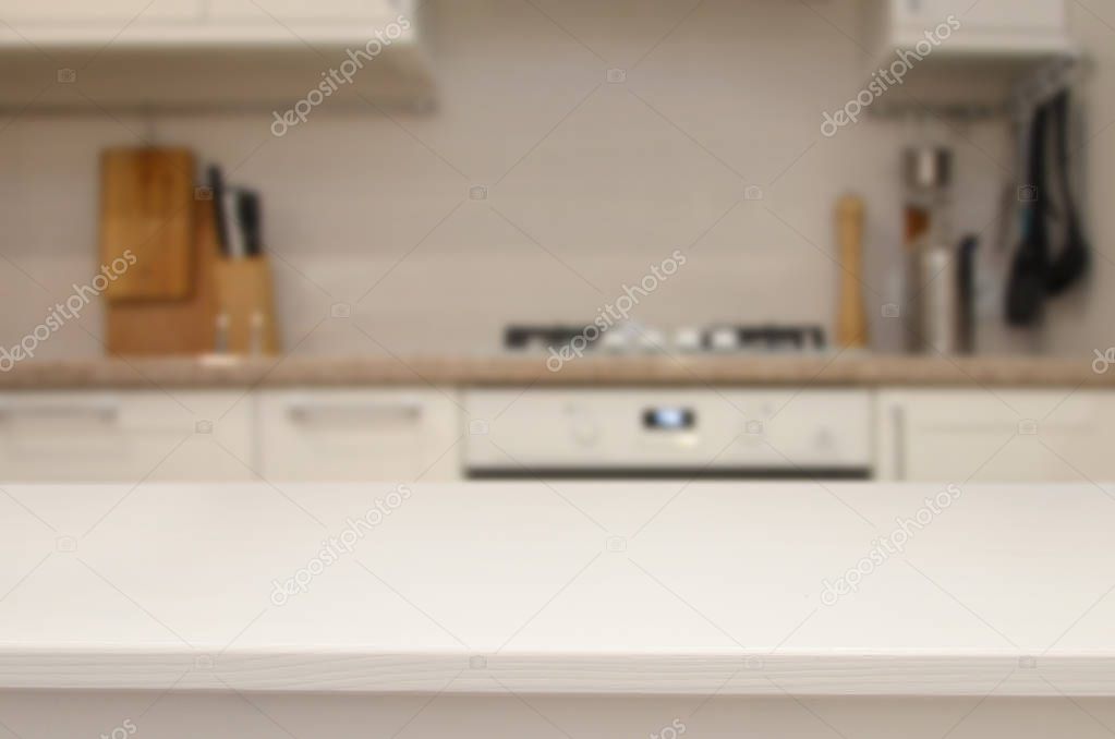 White table on the background of blurred kitchen interior. or montage your products