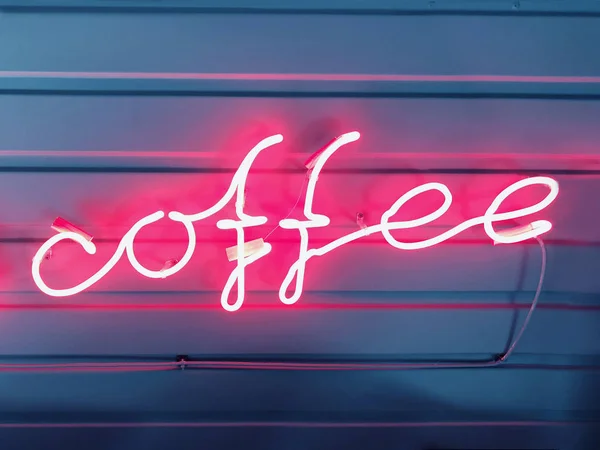 Words of coffee from a neon tube pink glow. — Stock Photo, Image