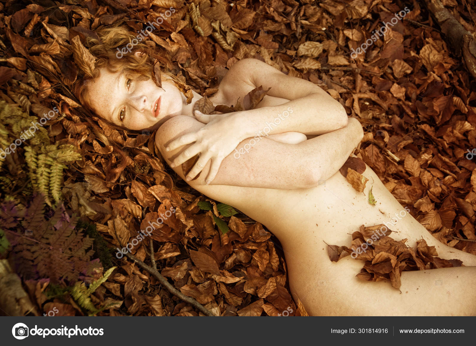 Golden-Haired sexy beauty undressed in park