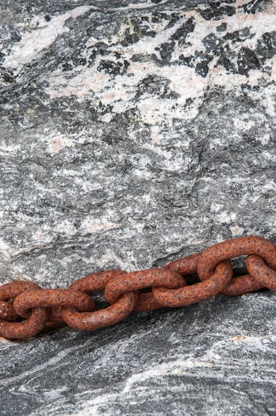 Old rusty chain on stone.Background
