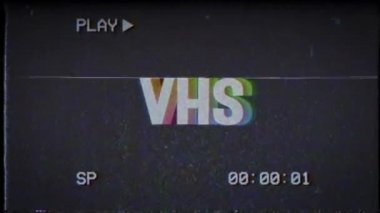 VHS kelimesinin renkli kinetik animasyonu. Retro stili 80 'ler. Bir kelimenin görünüp kaybolması.