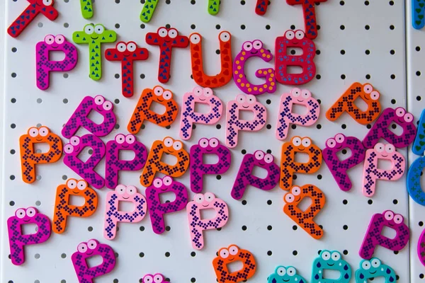 ornamental magnets made up of cute letters. colored letters