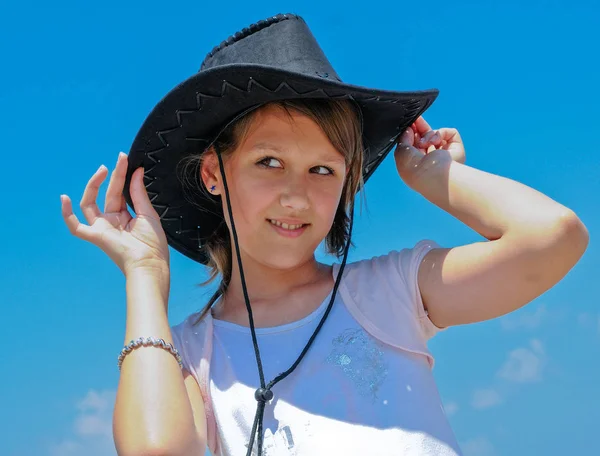 Teenage Girl Trying Black Cowboy Hat Blue — Stock Photo, Image