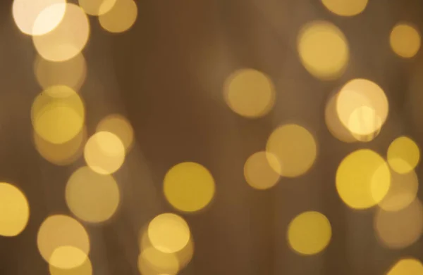 Abstract background with gold lights. Gold bokeh banner. Golden glitter. Festive sparkles. Empty background. Blurry texture. Defocus pattern. Abstract template. Retro background. Vintage confetti. New year, Christmas, Holiday concept.