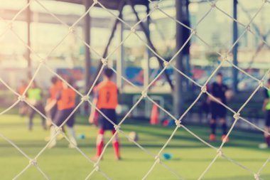 Beyaz örgü bulanık futbolcuların gol. futbol ya da futbol Akademisi.