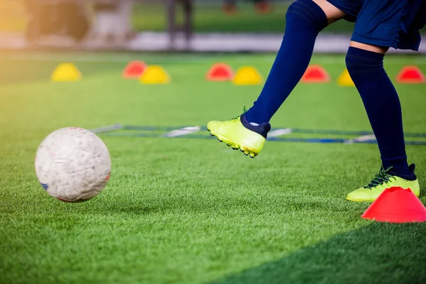 Soccer player jump and stomp for trap and control football with