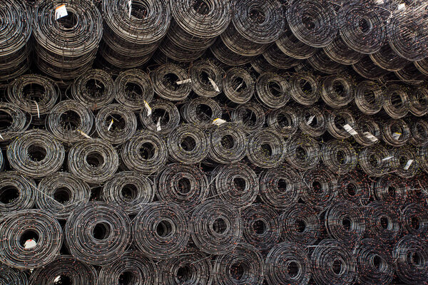 Rolls of iron mesh (wire mesh) use for reinforce concrete in construction site. background of rolls of iron mesh