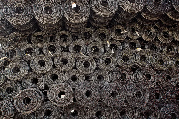 Rolls of iron mesh (wire mesh) use for reinforce concrete in construction site. background of rolls of iron mesh