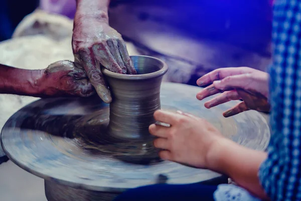Making it together. close-up to hands of potter teacher and chil — Stock Photo, Image