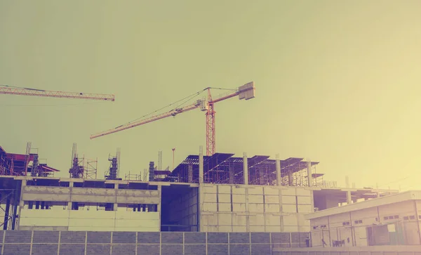 Building crane and buildings under construction — Stock Photo, Image