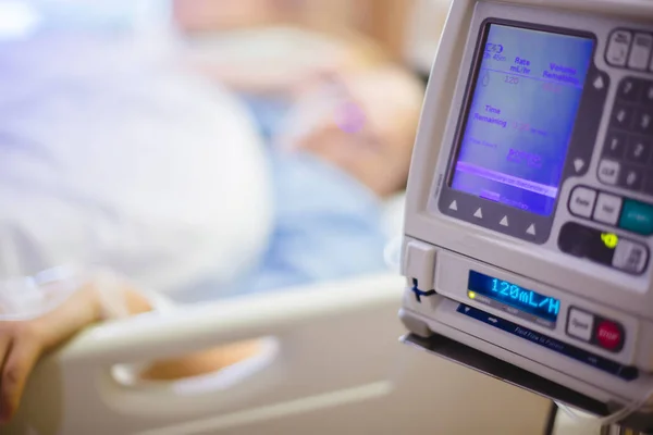Selective focus to Infusion pumps with blurry patient in hospita — Stock Photo, Image
