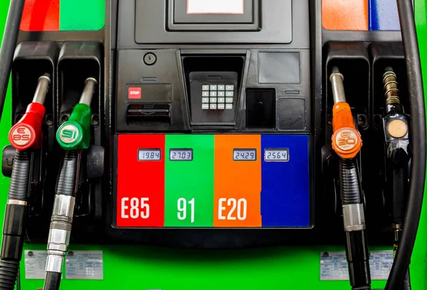 Gas pump nozzles in a service station, Close up fuel nozzles at — Stock Photo, Image