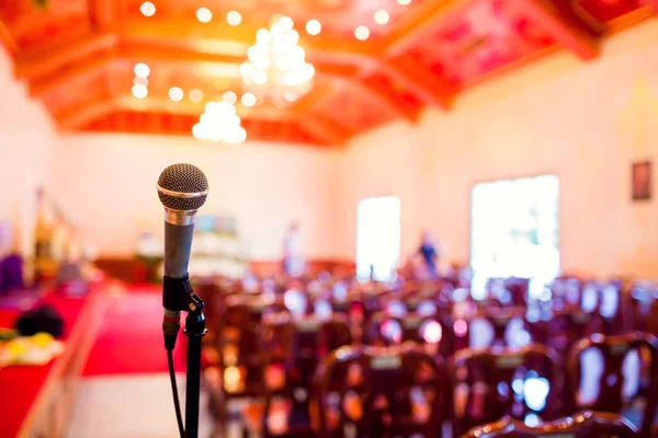 Microphone with blurry indoor location for Buddhist activities. The concept of speaker