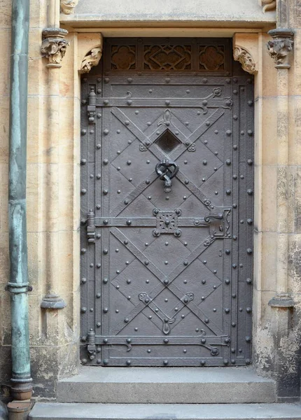 Medieval front door in the Prague castle, Czech Republic.