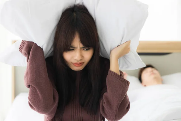 Asian Wife Using Pillows Cover Both Ears Because She Annoyed — Stock Photo, Image