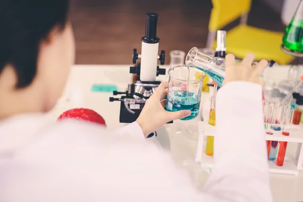 Scientists Experimenting Colorful Chemicals Beakers — Stock Photo, Image