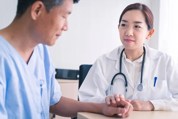 Woman Doctor Holds Hands Male Patients Encourage Royalty Free Stock Photos