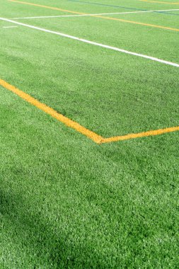 Futbol sahası ile yeni yapay çim alan. Yakın çekim. Futbol arka plan. Kopya alanı