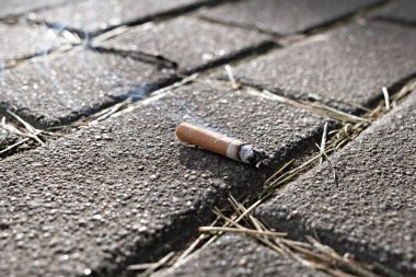 Cigarette end on floor. Smoking clipart