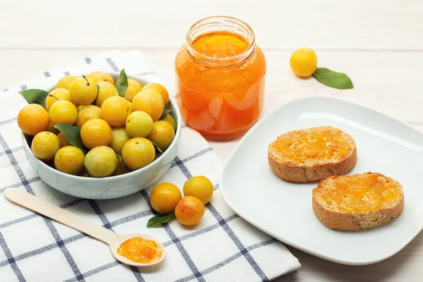 Pot of sweet jam, plum fruit and toasts — Stock Photo, Image