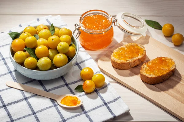 Pot of sweet jam, plum fruit and toasts — Stock Photo, Image