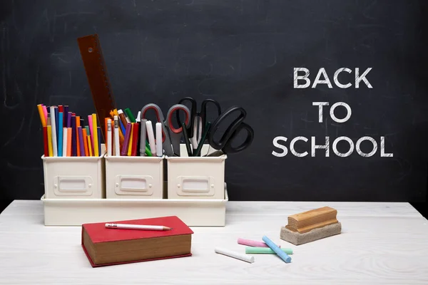 Back to school background concept with text on chalkboard