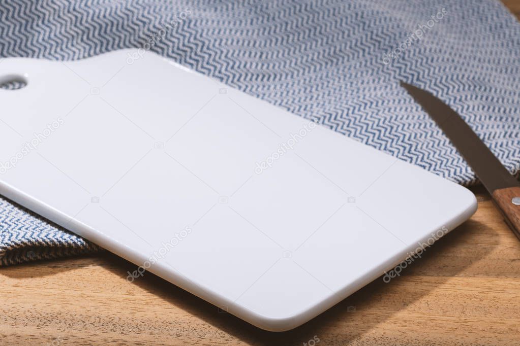 Cuisine background. Empty Porcelain tray or cutting board on wooden table