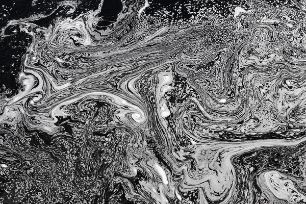 Polluted water surface with detergent or soap. Environmental damage. Abstract background