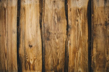 Arka planını kahverengi eski doğal ahşap plakalar ağaç kat desen doku Closeup altın yüzey günlüklerini görüntüleme ile vintage hafif sıcak iç içeride boş kırsal Oda karanlık yaşlı gölgeler.