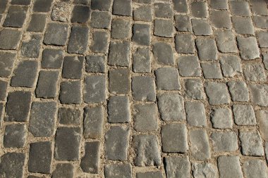 Taş kaldırım dokusu. Granit cobblestoned kaldırım arka plan. Arka plan eski kaldırım taşı kaldırım yakın çekim. Sorunsuz doku