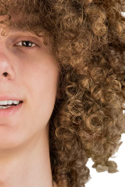 split in half cropped portrait of a young curly European man with long curly hair and a dreamy smile close-up. very lush male hair. curling hair men's. a lock of passion. isolated on white background