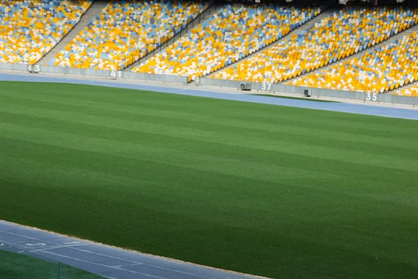 Soccer stadium inside view. football field, empty stands, a crowd of fans, a roof against the sky — Stock Photo, Image