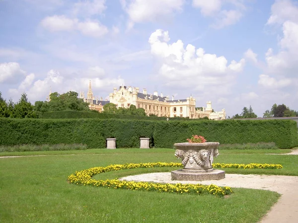 Castle garden with pedestals, in background Lednice castle, Czech Republic, image