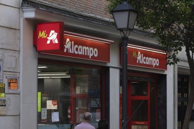 Madrid, Spain - May 18, 2020: Supermarket shop chain, Mi Alcampo, in the Retiro district. clipart