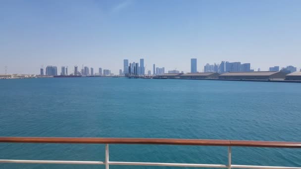 Sea port and view of the city with skyscrapers on the horizon. Sea port with moored ships. — Stock Video