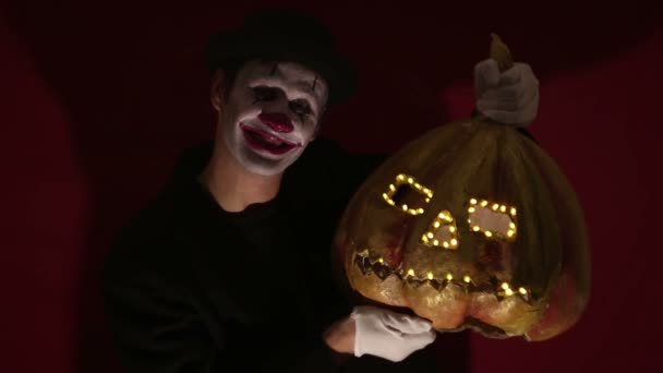 Scary Clown Holds Pumpkin Mask His Hands Scary Man Clown — Stock Video