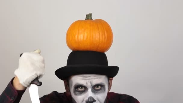 Terrible Man Clown Makeup Pumpkin His Head Threatens His Victim — Stock Video