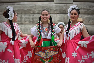 INDIANAPOLIS, IN/USA  MAY 2, 2018: Ballet folklrico is a collective term for traditional Mexican in dances that emphasize local folk culture with ballet characteristics - pointed toes, exaggerated movements, highly choreographed. clipart