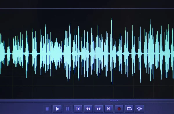 Audio sound wave studio editing computer program screen showings sounds on screen from vocal recording of voiceover.