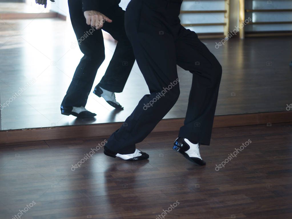 Male ballroom dance salsa dancer instructors man dancing in shcool rehearsal room