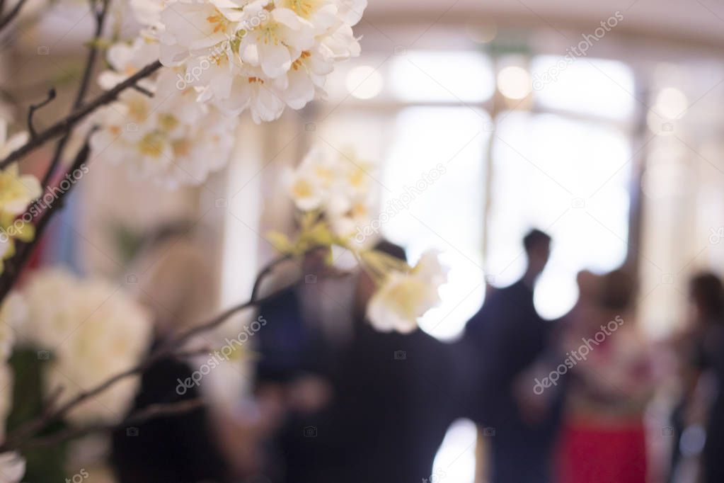 Wedding flowers arranged floral bouquet in marriage luxury 5 star hotel reception room.