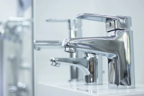 Bathroom tap sink showroom display of new design option for home building improvement works.