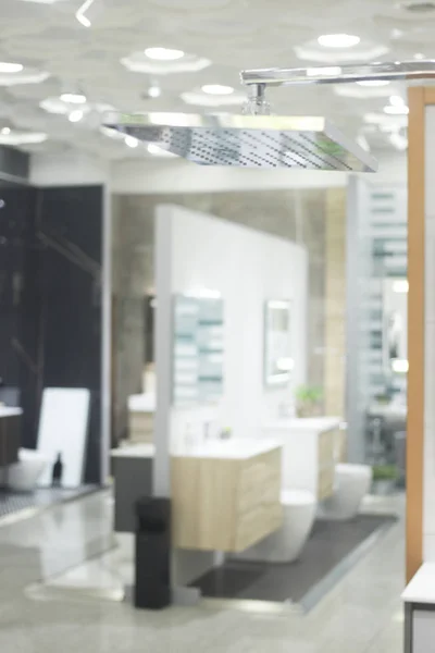 Bathroom chrome shower head showroom display of new design option for home building improvement.