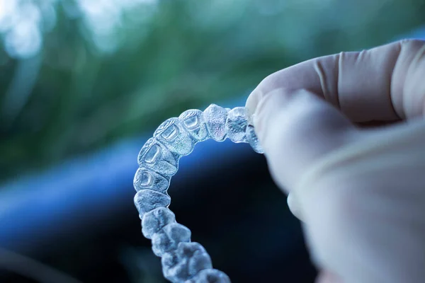 Invisible dental teeth aligners brackets used to align each tooth in cosmetic dentistry for patients.