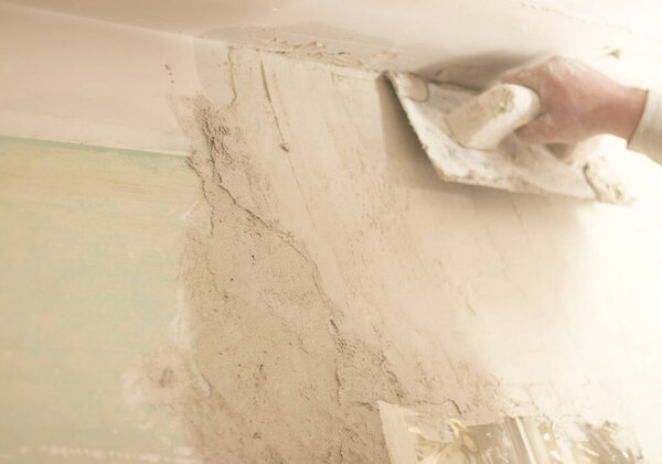 Building renovation works in appartment showing refurbishments works by builders to renovate walls.