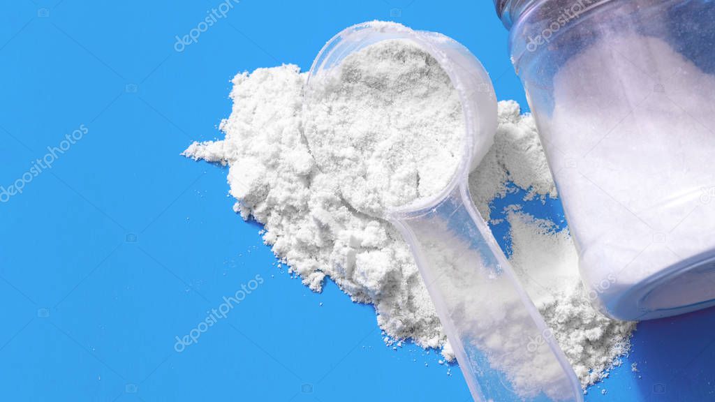 Sport supplement, creatine, hmb, bcaa, amino acid or vitamin mesure with powder. Sport nutrition concept. bcaa, l-carnitine, creatine in blue background