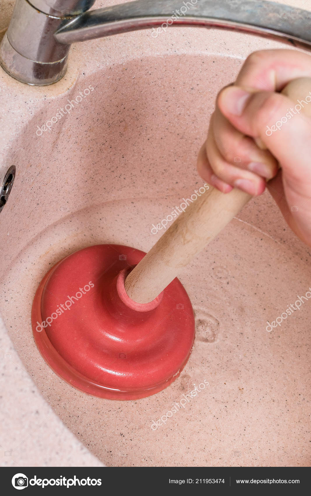 Man Clears Water Blockage Kitchen Sink Drain Common Plunger